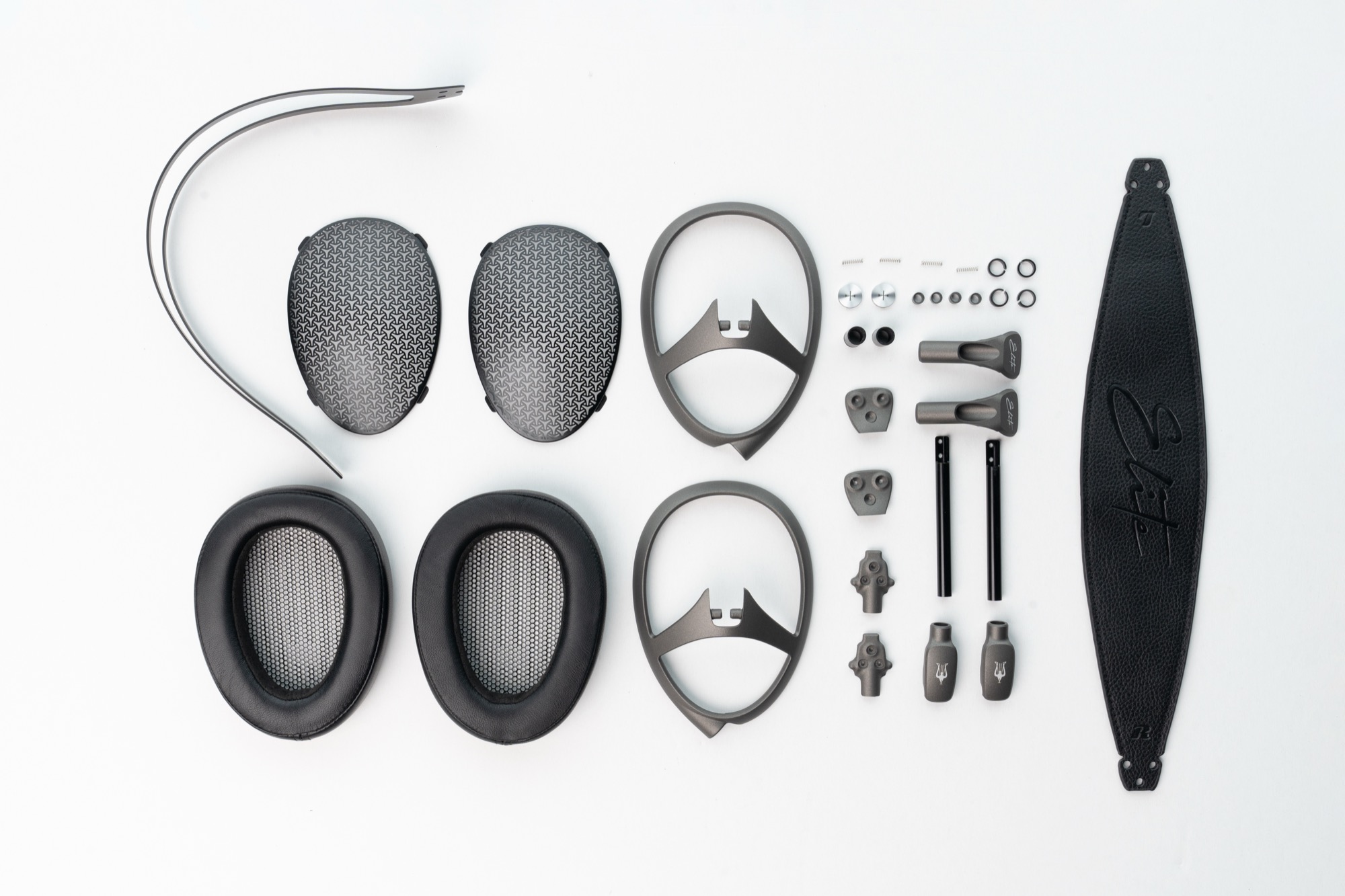 Parts of Meze Audio Elite headphones displayed on table